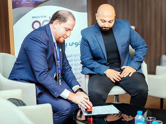 Stamping and signing an agreement at a business event